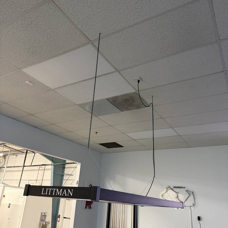 Suspended linear light fixture in a commercial office