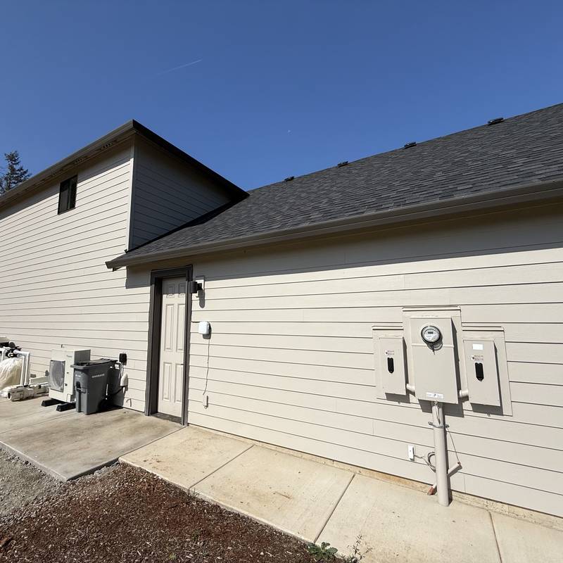 Finished electrical service and meter on the exterior of a new home