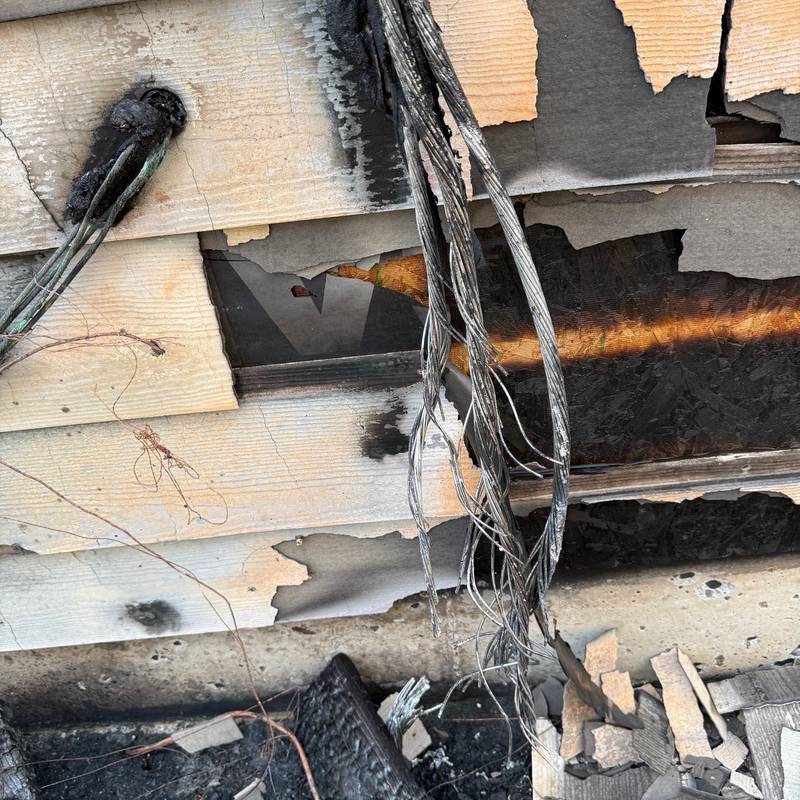 Melted service entrance cables after a house fire
