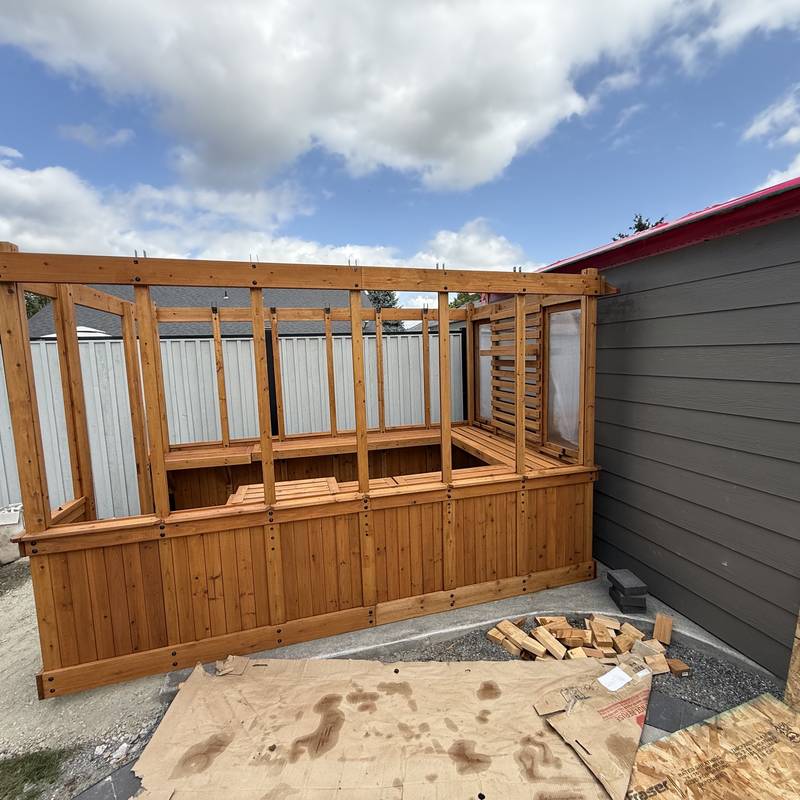 Cedar backyard sauna being wired for power