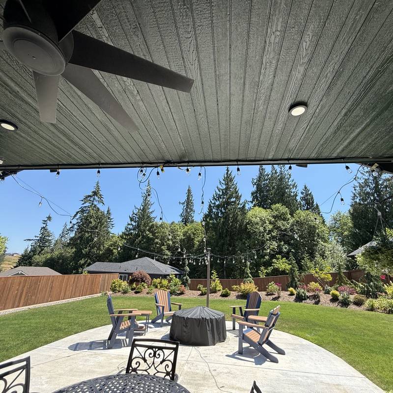 Covered backyard patio with recessed lighting and a ceiling fan