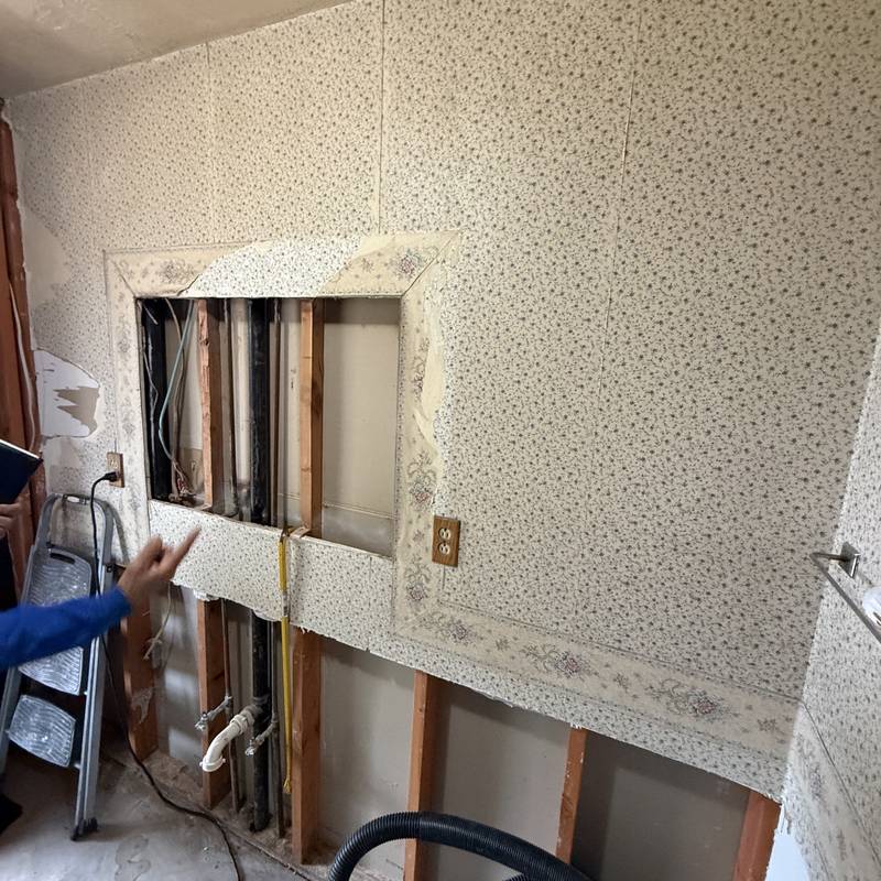 Wall opened up to run new electrical wiring in an older home